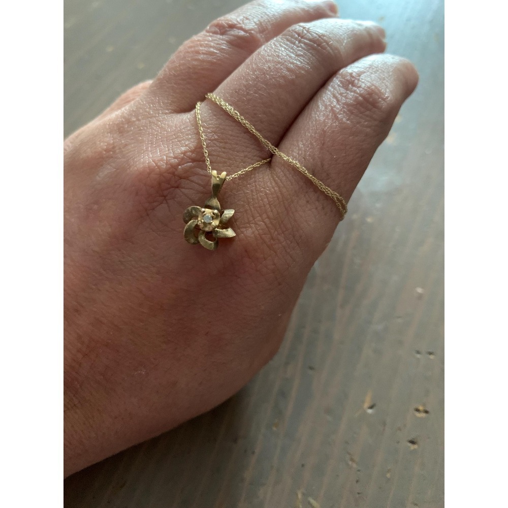 Vintage estate dainty 10k solid gold flower charm pendant with natural diamonds
